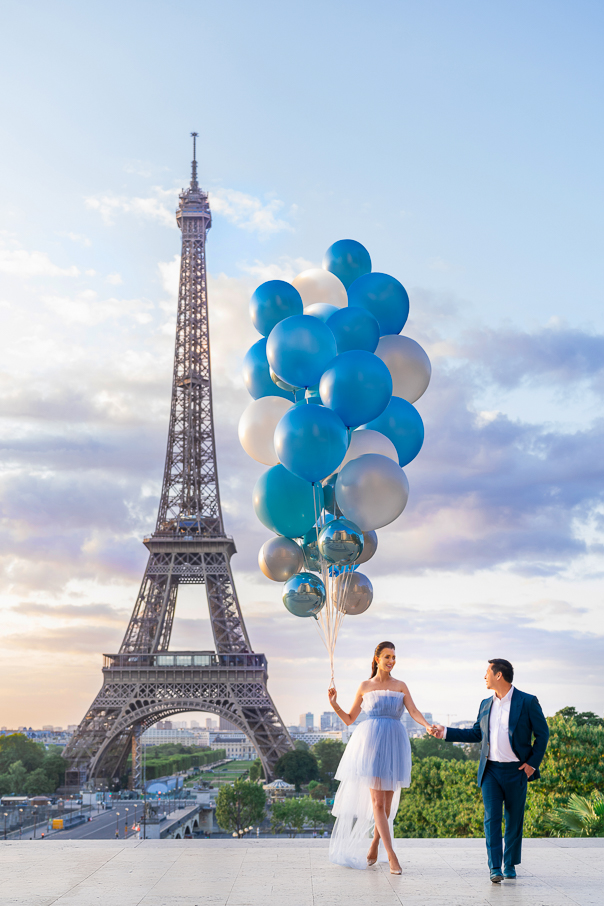 Gender reveal Eiffel Tower photos with blue balloons