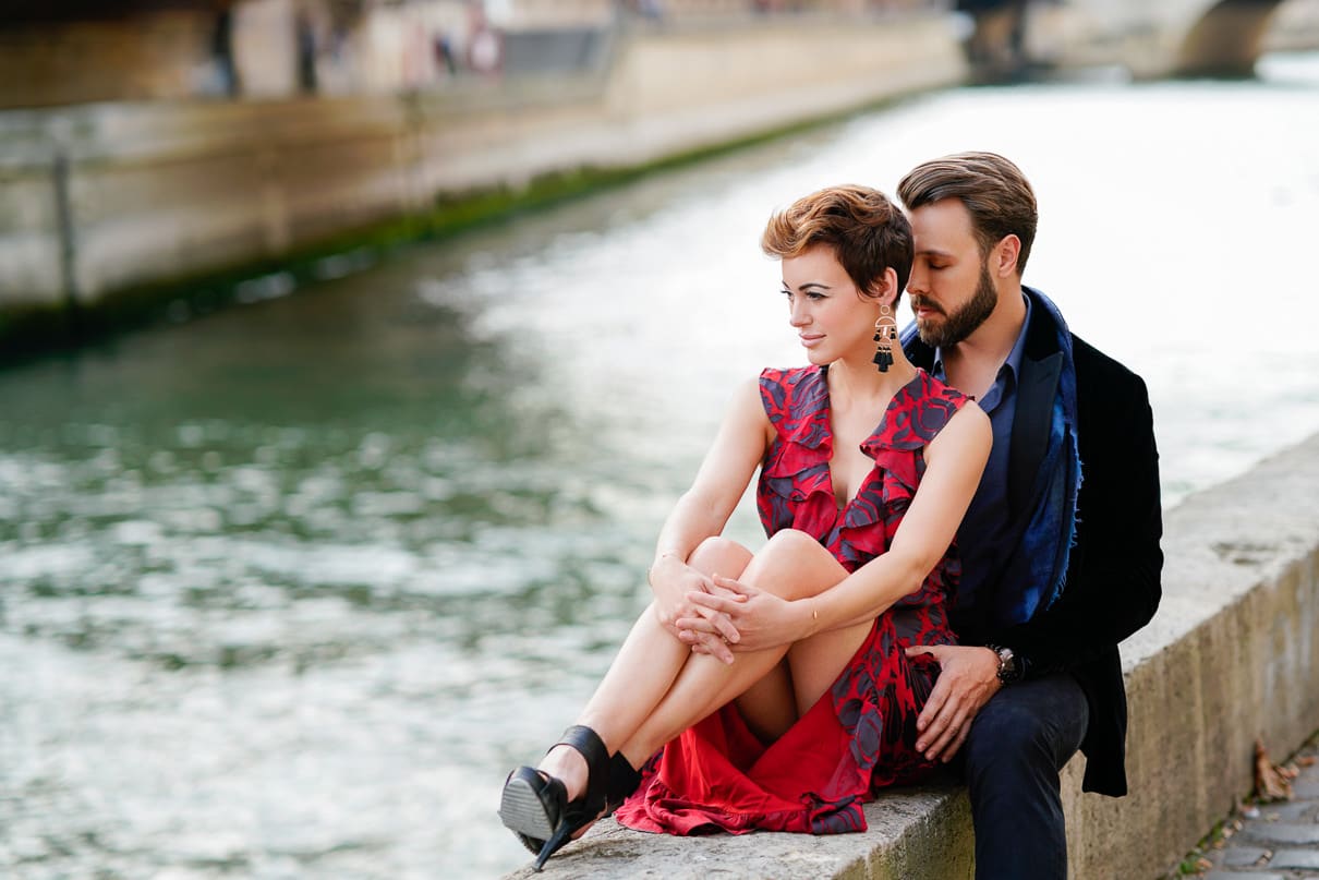 Romantic Paris engagement photos along the Seine River by Notre Dame